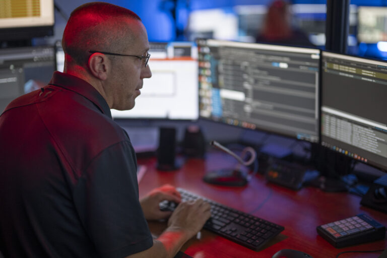 Dispatcher monitoring screens during shift