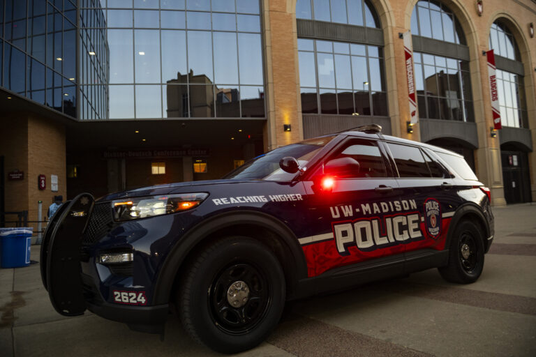 UWPD Squad at dusk in front on side of Camp Randall Stadium